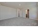 Spacious bedroom with neutral walls, carpet and view to bathroom and bedroom doors at 1420 Wildflower St, Newton, NC 28658