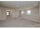 Spacious bonus room features neutral paint, carpeted flooring, and ample natural light at 1420 Wildflower St, Newton, NC 28658