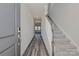 Inviting entryway features durable vinyl floors, a carpeted staircase, and neutral decor at 1420 Wildflower St, Newton, NC 28658