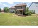 Back yard and covered patio perfect for outdoor relaxation at 14506 Knowledge Cir, Charlotte, NC 28277