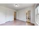 Bright bedroom with hardwood floors, a modern light, with access to an ensuite bathroom at 14506 Knowledge Cir, Charlotte, NC 28277