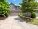 Charming two-story home with a brick facade, inviting front yard, and two-car garage at 14506 Knowledge Cir, Charlotte, NC 28277