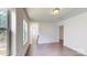 Hallway with hardwood floors and multiple windows offering natural light at 14506 Knowledge Cir, Charlotte, NC 28277