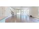 Bright living room with hardwood floors, stairs to the 2nd floor and sliding doors to the outside at 14506 Knowledge Cir, Charlotte, NC 28277