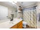 Cozy bathroom with modern mirror, patterned shower curtain, and ample lighting at 146 Comata Rd, Mooresville, NC 28117