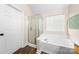 Well-lit bathroom with soaking tub and glass enclosed shower at 146 Comata Rd, Mooresville, NC 28117