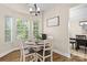 Cozy breakfast nook featuring lots of light, wood-look flooring, and seating for four at 146 Comata Rd, Mooresville, NC 28117