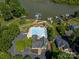 Aerial view of a community pool near the lake with an adjacent parking lot, building, and boat docks at 146 Comata Rd, Mooresville, NC 28117