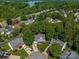 Two-story home in a suburban neighborhood with mature trees and well-maintained lawns in an aerial view at 146 Comata Rd, Mooresville, NC 28117
