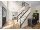 Open foyer with hardwood floors, staircase, and view of the office at 146 Comata Rd, Mooresville, NC 28117