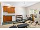 Home gym featuring exercise equipment, a mini fridge, storage cabinets, and a window at 146 Comata Rd, Mooresville, NC 28117