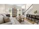 Bright and airy living room with hardwood floors, staircase, and natural light at 146 Comata Rd, Mooresville, NC 28117