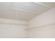View of the attic with pull-down stairs and wire shelving for ample storage at 15037 Taylor Ridge Ln # 25, Charlotte, NC 28273