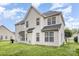 Two-story home featuring a well-manicured backyard with a lush green lawn at 15037 Taylor Ridge Ln # 25, Charlotte, NC 28273
