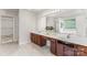 Bathroom featuring a double sink vanity, and a large mirror reflecting the tub and the shower at 15037 Taylor Ridge Ln # 25, Charlotte, NC 28273