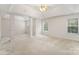 Spacious bedroom with neutral colors and carpet floor featuring natural light from multiple windows at 15037 Taylor Ridge Ln # 25, Charlotte, NC 28273