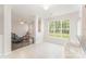 Open breakfast nook with bright windows, bar stools, and an easy transition into the living room at 15037 Taylor Ridge Ln # 25, Charlotte, NC 28273
