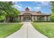 Community clubhouse with stone columns, well-manicured lawn, and covered seating at 15037 Taylor Ridge Ln # 25, Charlotte, NC 28273