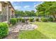 Outdoor grill and patio area surrounded by lush green landscaping, near community pool and amenities at 15037 Taylor Ridge Ln # 25, Charlotte, NC 28273