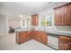 Spacious kitchen featuring granite countertops, wood cabinets, and stainless steel appliances at 15037 Taylor Ridge Ln # 25, Charlotte, NC 28273
