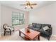 Cozy room featuring a comfortable gray sofa, armchair, coffee table, and a large window at 15037 Taylor Ridge Ln # 25, Charlotte, NC 28273