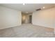 Spacious bonus room offering neutral walls, plush carpeting, and a staircase to the lower level at 1505 Harper Landing Blvd, Stanley, NC 28164