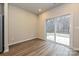 Dining room with hardwood floors and sliding glass door leading to backyard at 1505 Harper Landing Blvd, Stanley, NC 28164