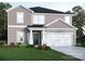 Charming two-story home featuring a gray exterior, landscaped front yard, and an attached two-car garage at 1505 Harper Landing Blvd, Stanley, NC 28164