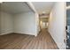 View of the living room with hard wood floors and natural light shining through the open space at 1505 Harper Landing Blvd, Stanley, NC 28164