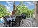 The back deck features an outdoor dining table, grill, and basketball hoop at 16109 Reynolds Dr, Indian Land, SC 29707