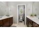 Well-lit bathroom with double vanities and a separate toilet room for added privacy at 16109 Reynolds Dr, Indian Land, SC 29707