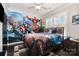 Vibrant bedroom with custom mural, fun decor, and natural light at 16109 Reynolds Dr, Indian Land, SC 29707