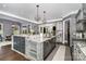 Spacious kitchen featuring granite countertops, custom cabinets, and stainless steel appliances at 16109 Reynolds Dr, Indian Land, SC 29707