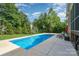Relaxing in-ground pool with mature trees, lounge chairs and basketball hoops for entertaining at 16109 Reynolds Dr, Indian Land, SC 29707