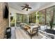 This screened porch offers a relaxing space with a ceiling fan and wooded views at 16109 Reynolds Dr, Indian Land, SC 29707