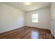 Bright bedroom featuring hardwood floors and a window offering natural light at 175 Triplett Rd, Cleveland, NC 27013