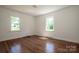 Bright bedroom with hardwood floors and natural light from two windows at 175 Triplett Rd, Cleveland, NC 27013