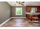 Eat-in kitchen dining area featuring laminate flooring and wood cabinets at 175 Triplett Rd, Cleveland, NC 27013