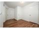 Bright hallway with hardwood floors and multiple doorways at 175 Triplett Rd, Cleveland, NC 27013