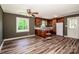 Cozy kitchen with wood cabinets, modern flooring, and ample natural light, and stainless steel fridge at 175 Triplett Rd, Cleveland, NC 27013