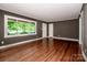 Bright living room with beautiful hardwood floors, a large window, and neutral wall color at 175 Triplett Rd, Cleveland, NC 27013