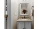 Elegant half bathroom with granite countertop and stylish fixtures at 18846 Cloverstone Cir, Cornelius, NC 28031