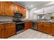 Spacious kitchen featuring stainless steel appliances, light oak cabinets, and an open floor plan at 18846 Cloverstone Cir, Cornelius, NC 28031