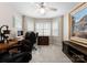 Bright office space featuring two desks, dual monitors, and natural light from bay windows at 18846 Cloverstone Cir, Cornelius, NC 28031