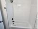 Bathroom featuring a white shower and tub combination with matte black fixtures at 1900 Walkup Ave # 1, Monroe, NC 28110