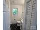 Modern bathroom with a new toilet, hexagon flooring, and natural light at 1900 Walkup Ave # 1, Monroe, NC 28110