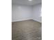 This bedroom features neutral walls, updated flooring, and a window at 1900 Walkup Ave # 1, Monroe, NC 28110