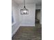 Dining area features modern light fixture, neutral walls, and updated flooring at 1900 Walkup Ave # 1, Monroe, NC 28110