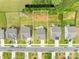An aerial view of the property showcasing the lot lines, surrounding trees, and nearby houses at 191 Tackle Box Dr, Troutman, NC 28166