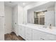 Modern bathroom with a double vanity, large mirror, and stylish tiled shower at 191 Tackle Box Dr, Troutman, NC 28166